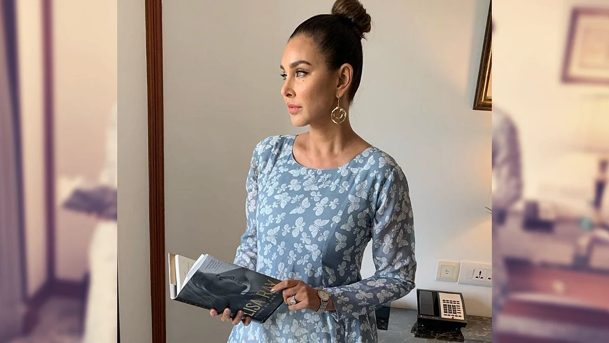Lisa Ray poses with a copy of her book, Close to the Bone