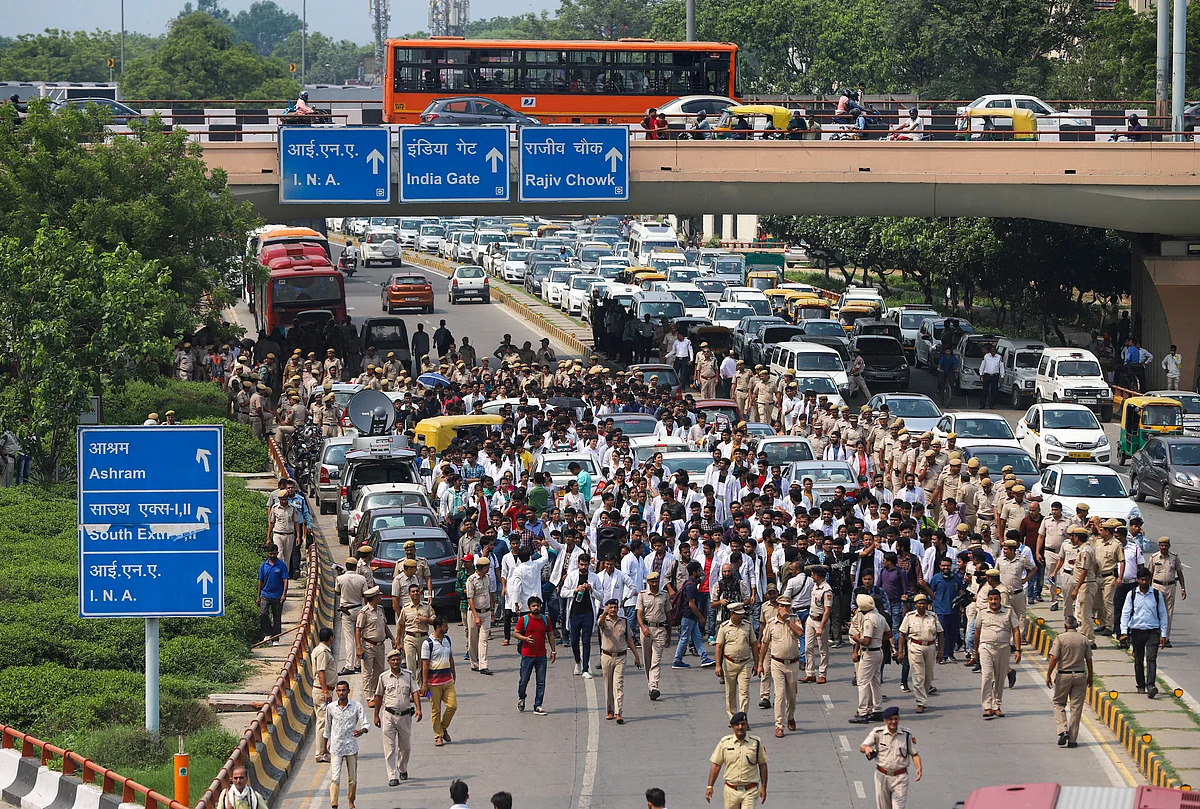 Doctors and medical students take part in a procession in protest against the National Medical Commission (NMC) Bill, near AIIMS in New Delhi. The bill seeks to regulate medical education and practices in India. The bill proposes to replace Medical Council of India with National Medical Commission and introduce a common final-year MBBS examination.