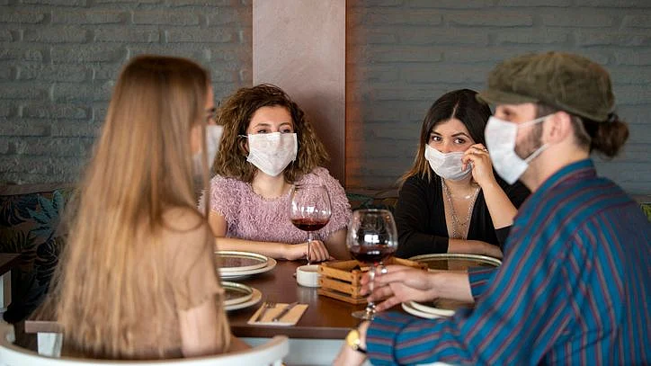 People dining at a restaurant are at a higher risk than those engaging in some other community activities.