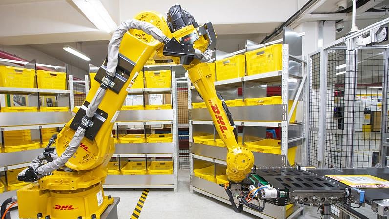 automated warehouse robots sorting packages