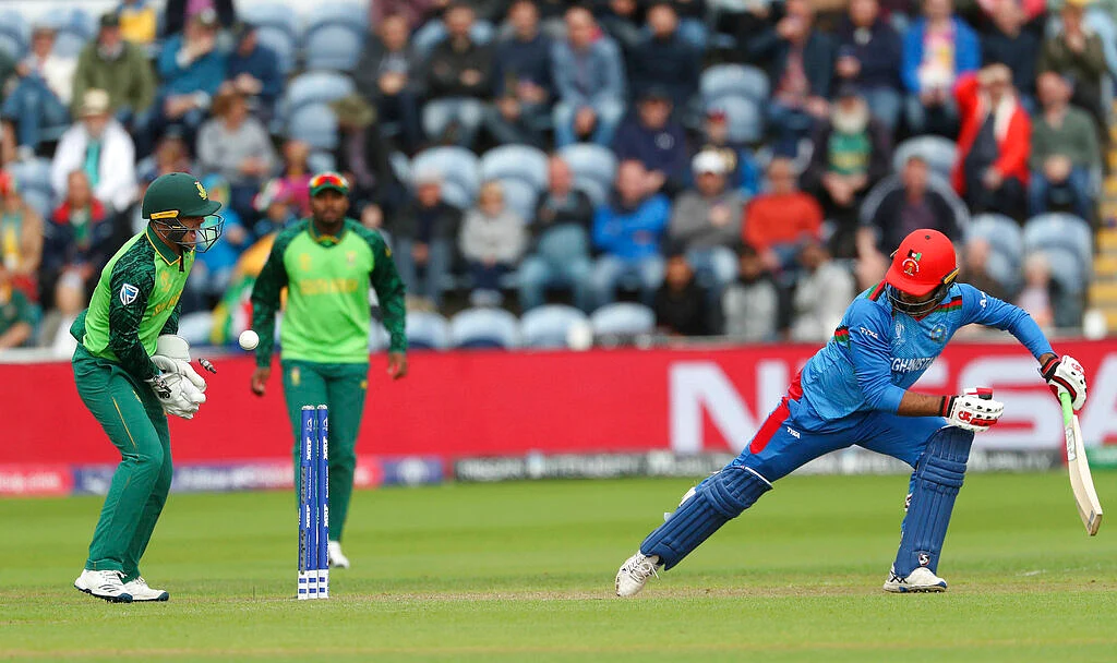 Noor Ali Zadran is bowled by South Africa's Imran Tahir.
