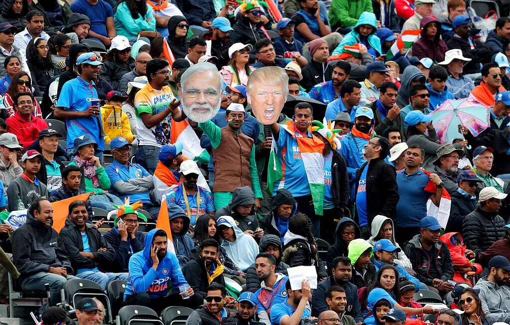Indian supporters display portraits of U.S. President Donald Trump and Indian Prime Minister Narendra Modi during the Cricket World Cup semi-final match between India and New Zealand at Old Trafford in Manchester.