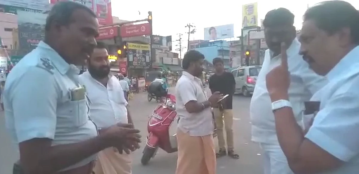 போலீஸ் அதிகாரியை மிரட்டிய அ.ம.மு.க பிரமுகர்