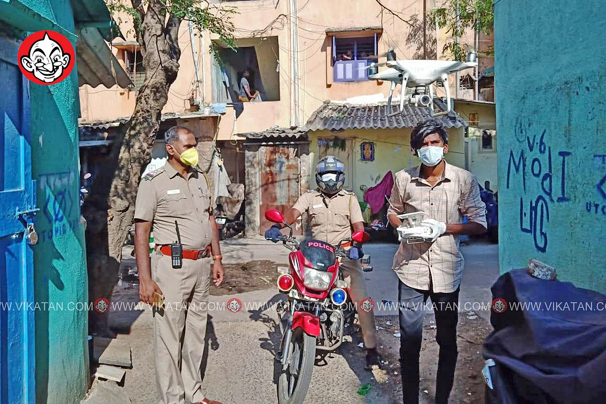 ஹெலிகேமரா உதவி கொண்டு சுற்றுப்பகுதியை பார்வையிடும் காவல்துறை.