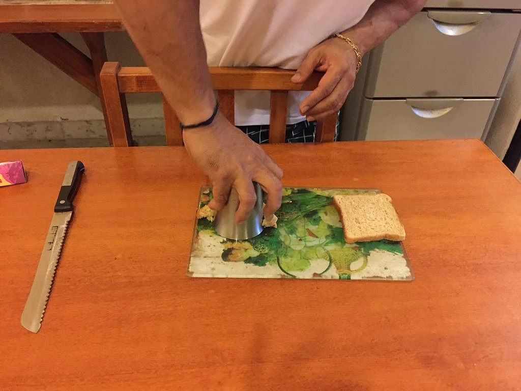 Cut the bread into shape using a tumbler.