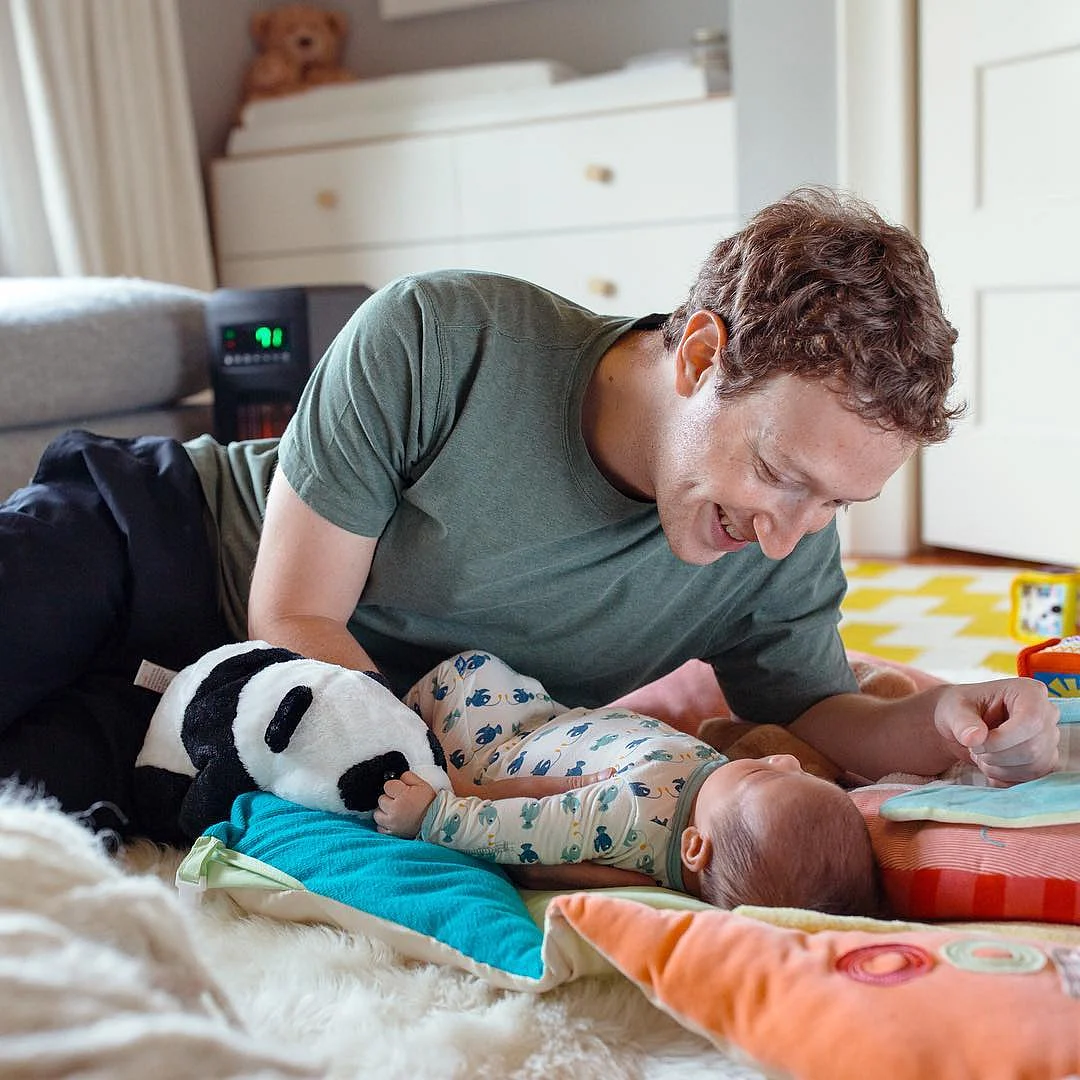 Mark Zuckerberg with his child