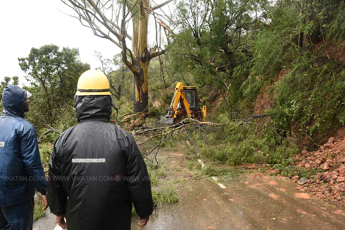Fire and rescue service personnel clear roads.