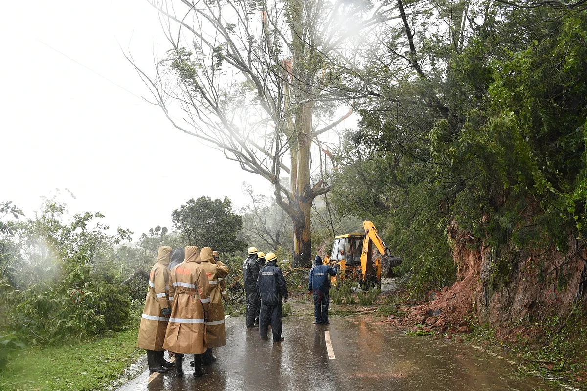Fire and rescue service personnel clear roads.
