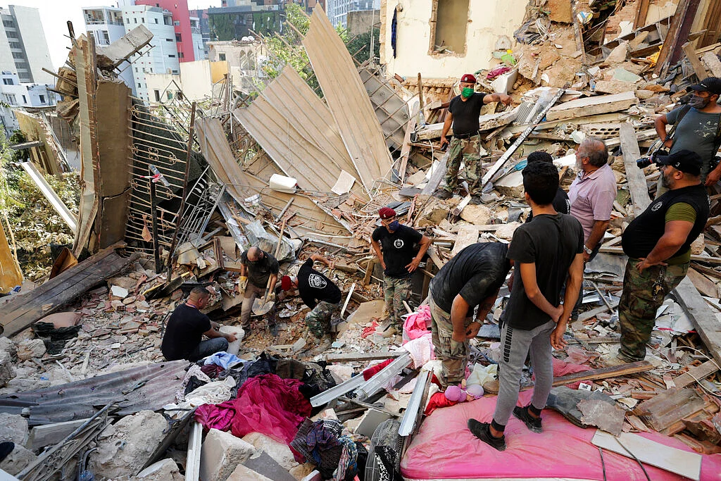 Lebanese soldiers search for survivors after a massive explosion in Beirut, Lebanon