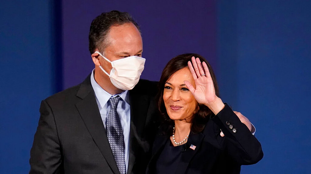 Kamala Harris, waves with her husband Douglas Emhoff