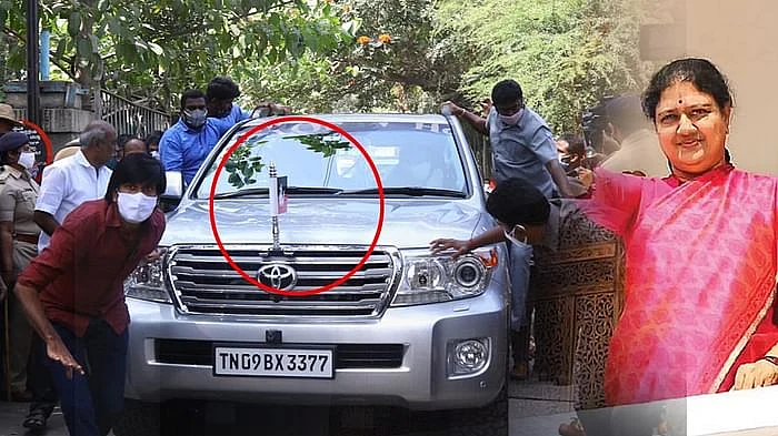 காரில் அ.தி.மு.க கொடி