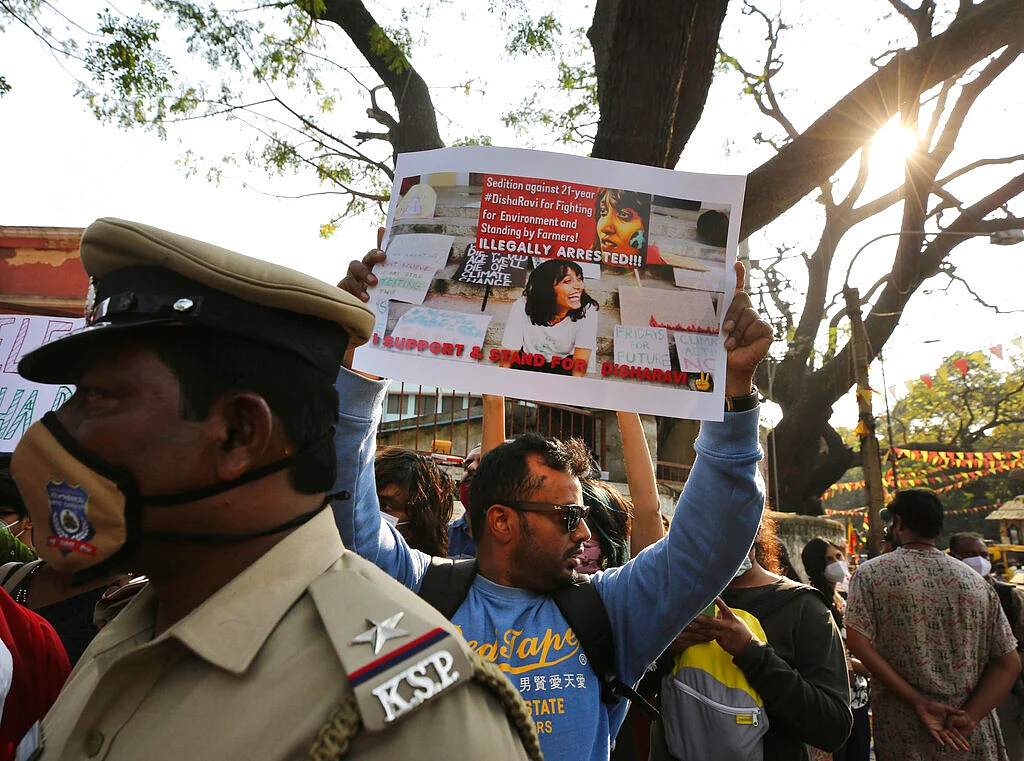 A man holds a placard demanding the release of Indian climate activist Disha Ravi, during a protest in Bengaluru