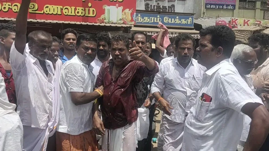 தீக்குளிக்க முயன்ற தி.மு.க தொண்டரால் பரபரப்பு