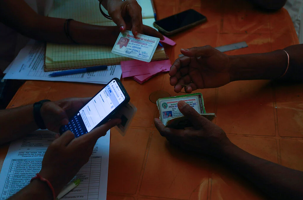 People register their names to receive COVISHIELD vaccine at a government hospital in Siddipet, Telangana state, India