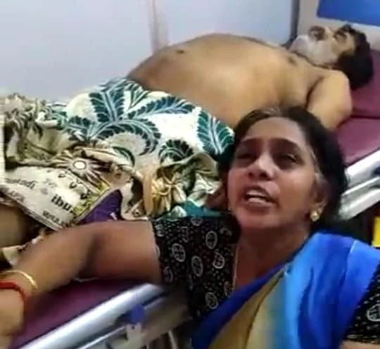 கொரோனாவால் உயிரிழந்த கணவர் சடலத்துடன் கதறிய பெண்