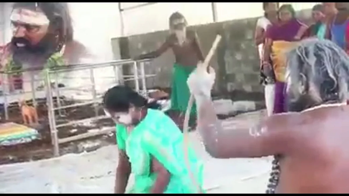 பெண்ணை அடிக்கும் சாமியார்