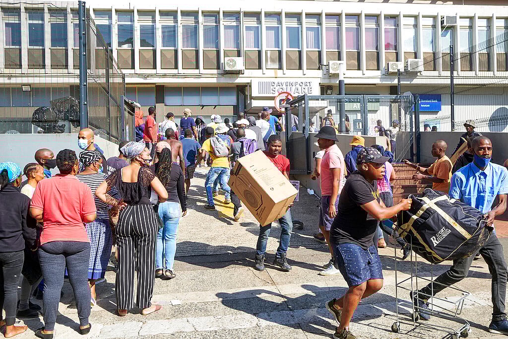 Looters make off with goods at a store in Durban, South Africa