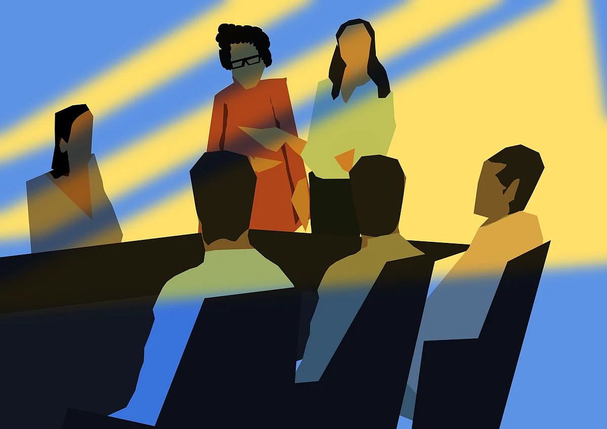 Pavan and Kavya in a meeting room with participants