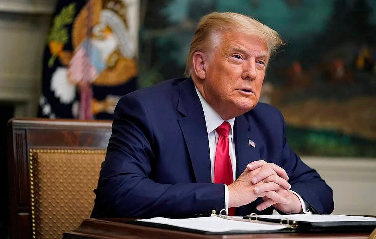 President Donald Trump participates in a video teleconference call with members of the military on Thanksgiving, Thursday, Nov. 26, 2020, at the White House in Washington. (AP Photo/Patrick Semansky)