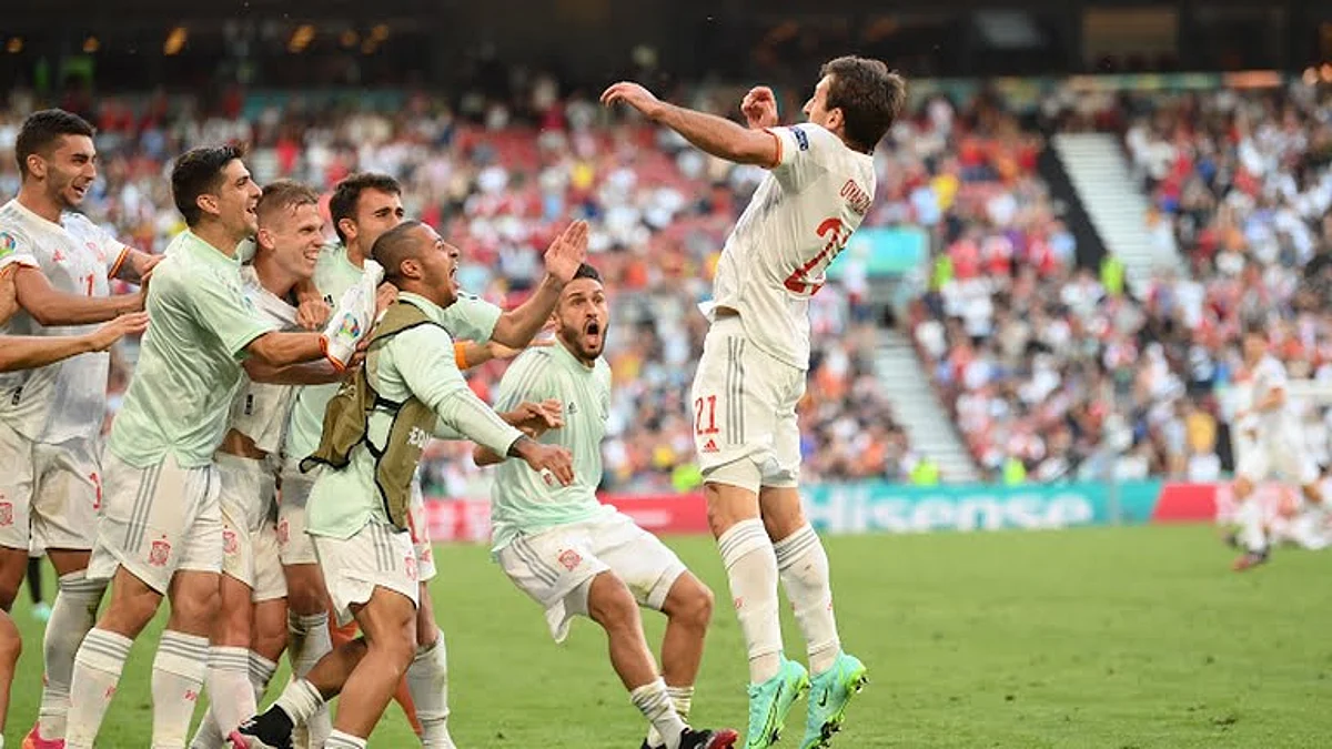 Mikel Oyarzabal, right, celebrates after scoring the fifth goal for Spain. Photograph: Reuters