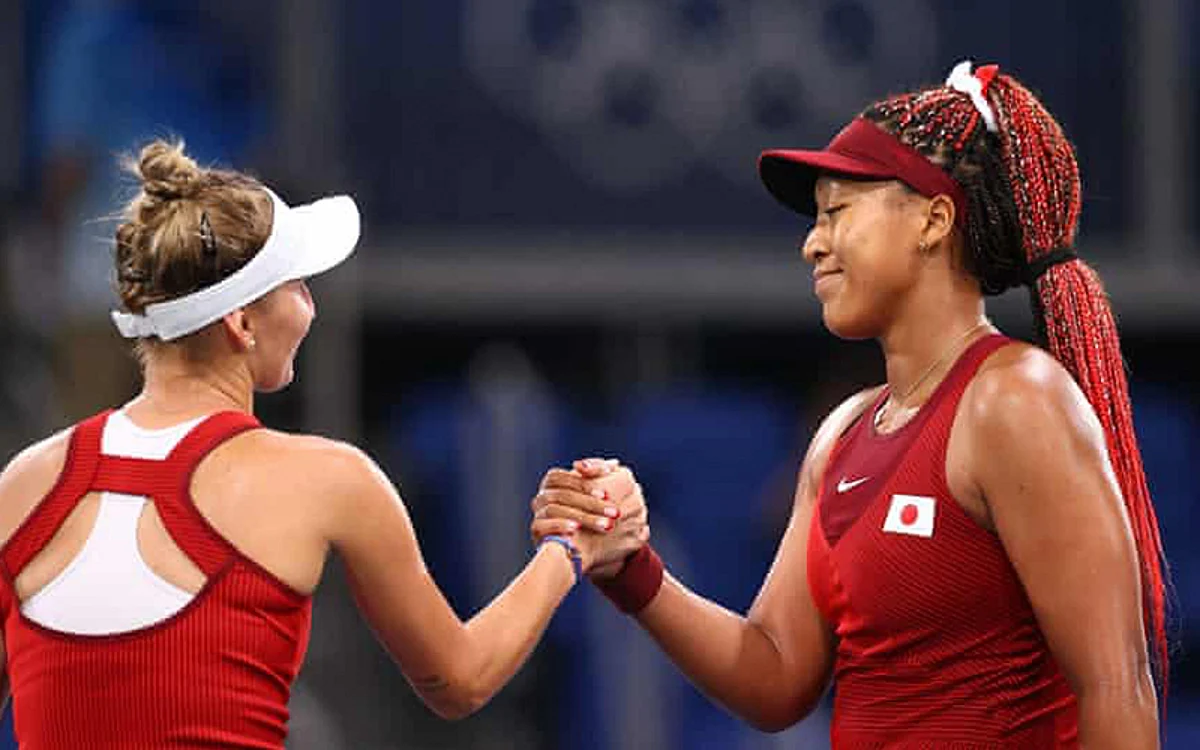 Czech player Marketa Vondrousova shakes hands with Naomi Osaka as the Japanese bowed out of the Tokyo Olympics women’s singles. Photograph: Edgar Su/Reuters