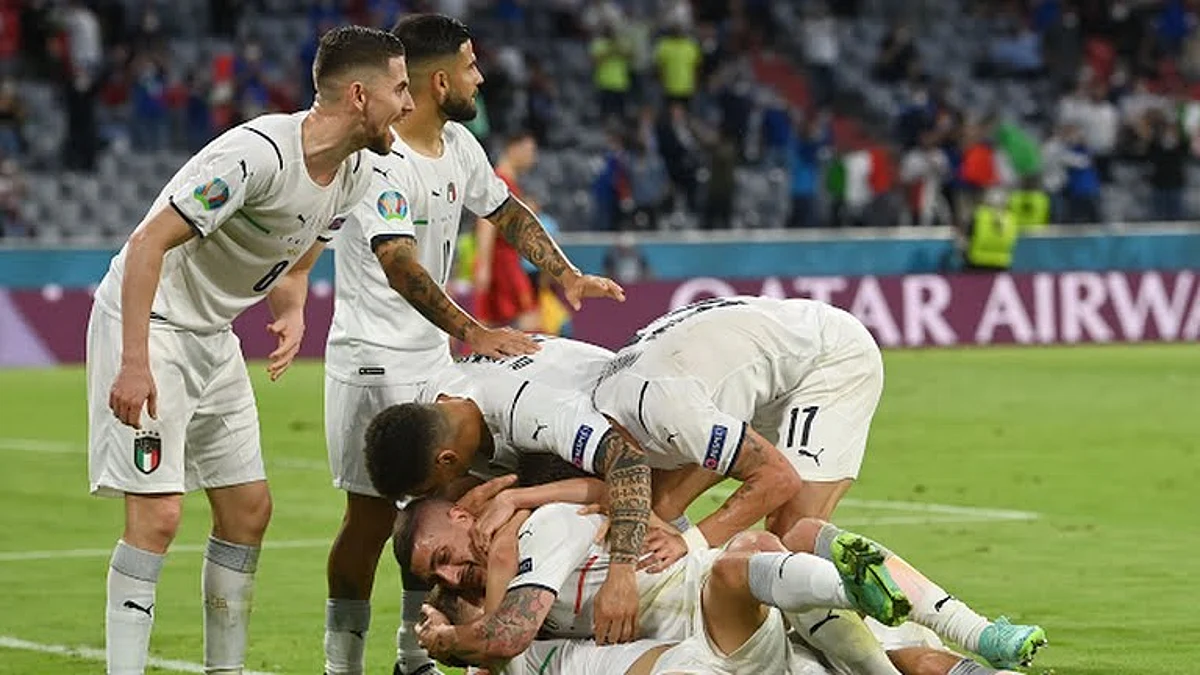 Italian players celebrate against Belgium in EURO 2020 victory ~ Reuters