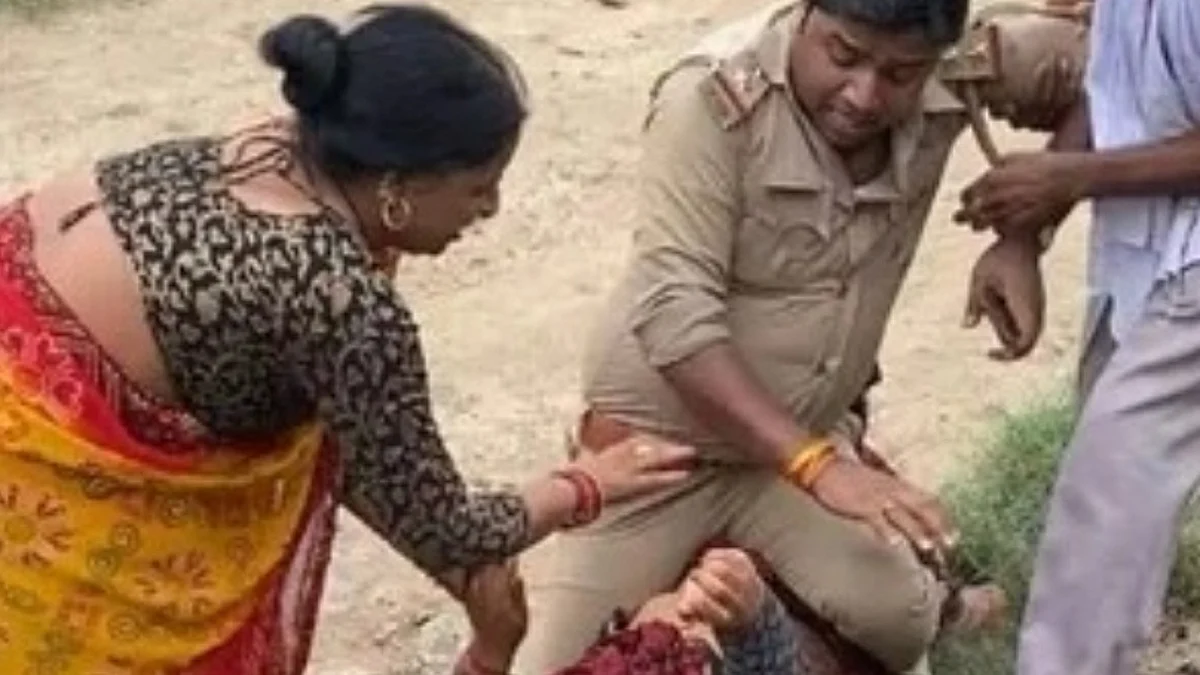 पुलिस अधिकारी पर महिला के ऊपर बैठकर मारपीट करने का आरोप